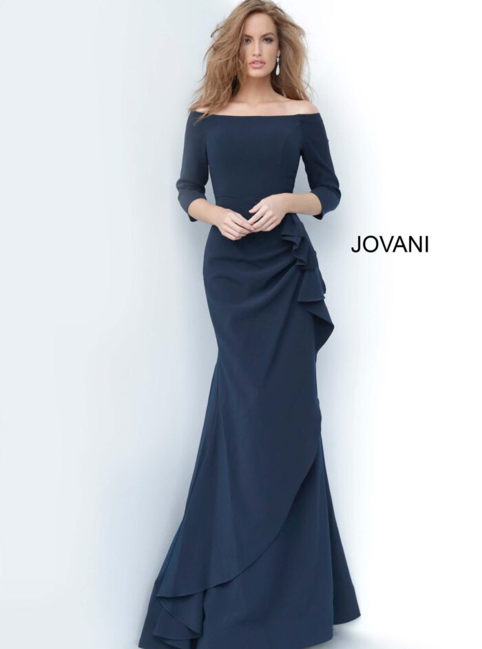 Model wearing Jovani 00446 navy off-the-shoulder mermaid gown with ruffle detail.