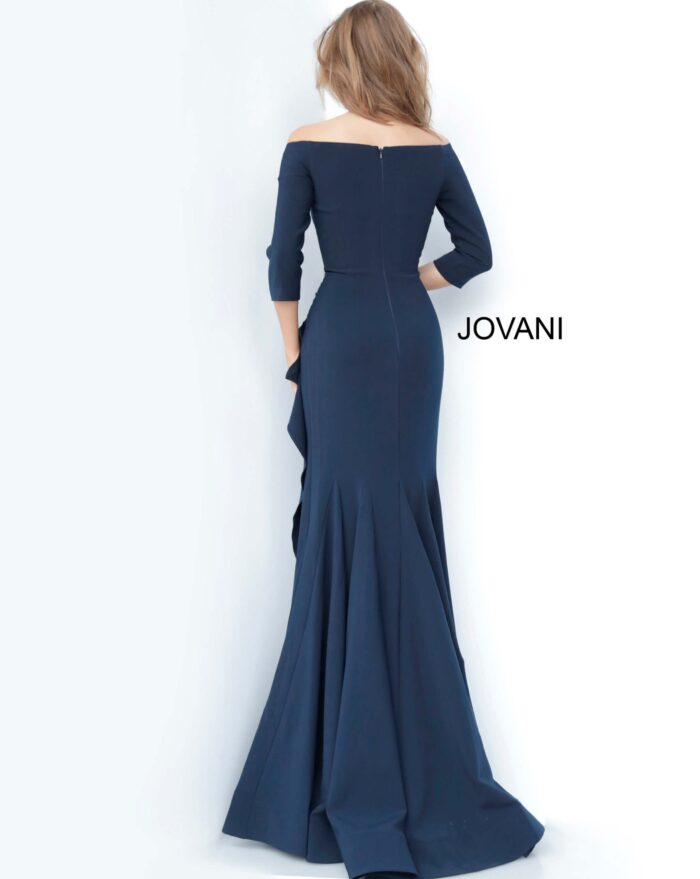 Back view of model wearing Jovani 00446 navy off-the-shoulder mermaid gown.