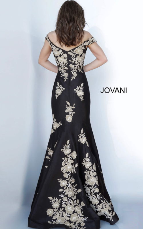Model wearing Jovani 00635 black gown with gold floral embroidery, back view.