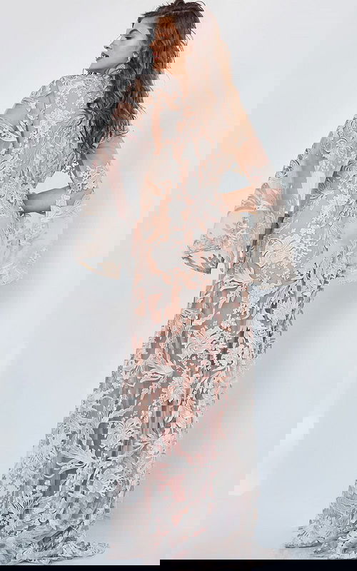 back view of model wearing Jovani 00752 beige A-line gown with floral embroidery