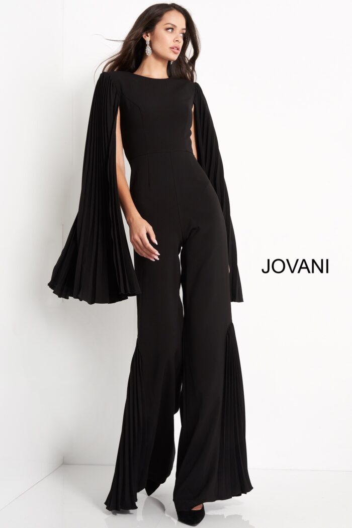 Model wearing Jovani 00756 black jumpsuit with pleated cape sleeves, alternate front view.
