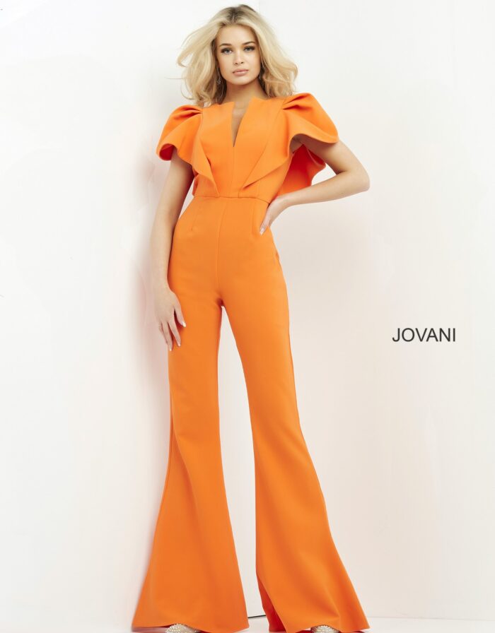 Model showcasing Jovani 00762 orange jumpsuit with notched neckline.