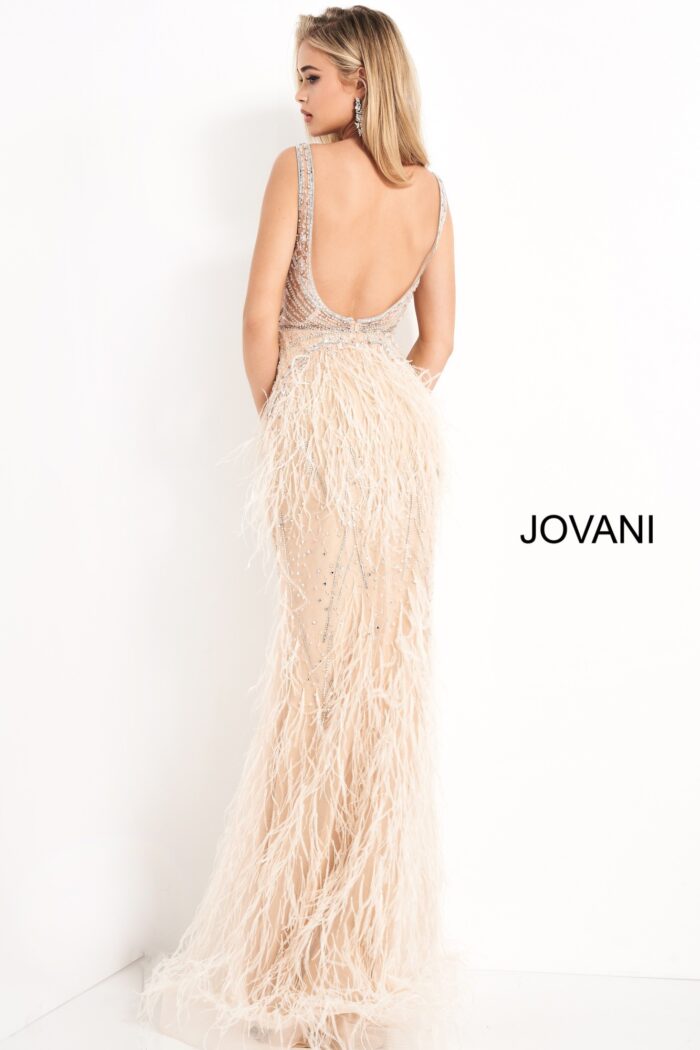 Back view of model in Jovani 03023 blush gown with low scoop back.