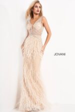 Model wearing Jovani 03023 blush beaded gown with feather embellishments.