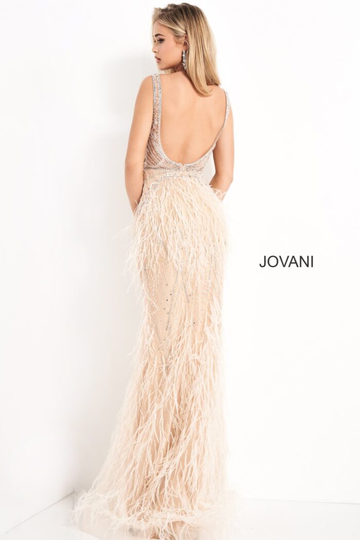 Model in Jovani 03023 blush gown showcasing beaded details.