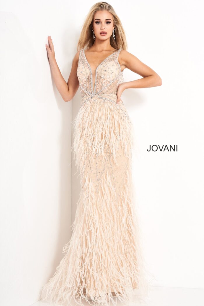 Model wearing Jovani 03023 dress in blush with beadwork and feather detailing.