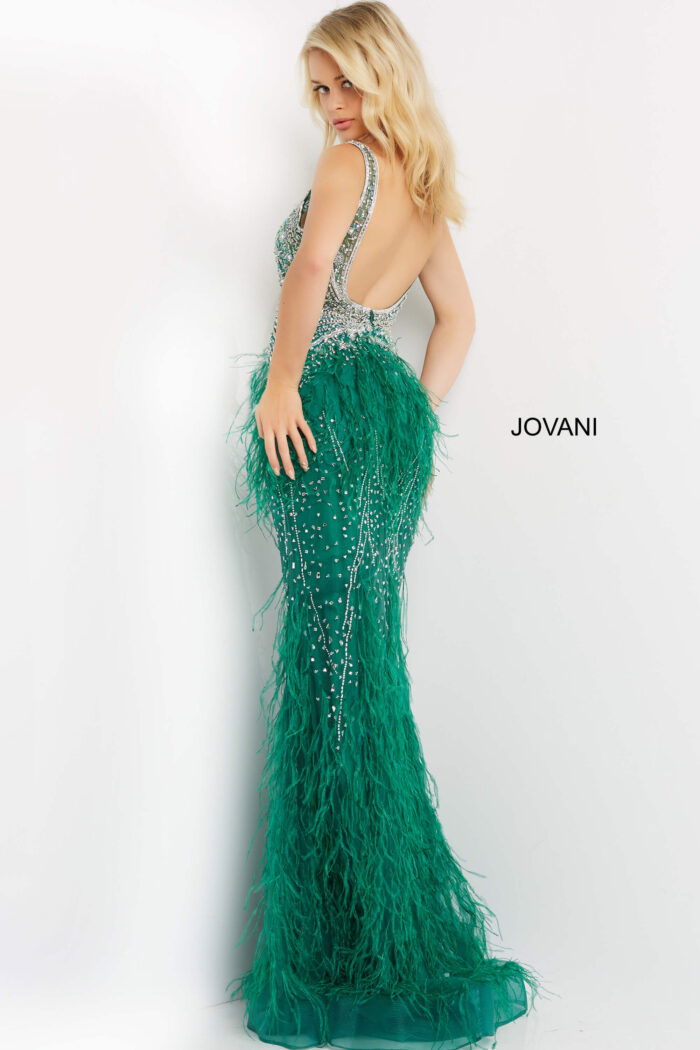 Back view of model in Jovani 03023 green gown with feathered skirt.