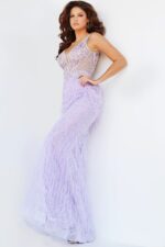 Model in Jovani 03023 lilac gown showcasing intricate bead and feather embellishments.