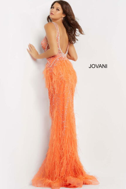 Back view of model in Jovani 03023 orange gown with elegant scoop back.