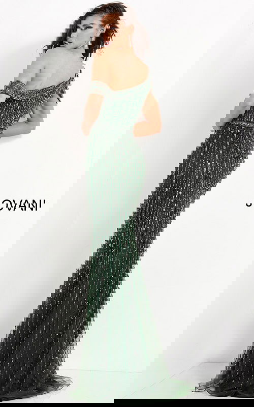 Back view of model in Jovani 03124 highlighting the off-the-shoulder design and flowy skirt.