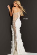 Model wearing Jovani 03389 white gown with floral embellishments and feathers, back view.
