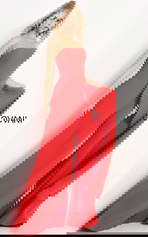 Model wearing Jovani 03529 red jumpsuit, angled front view, highlighting strapless neckline and flowing wide-leg style.