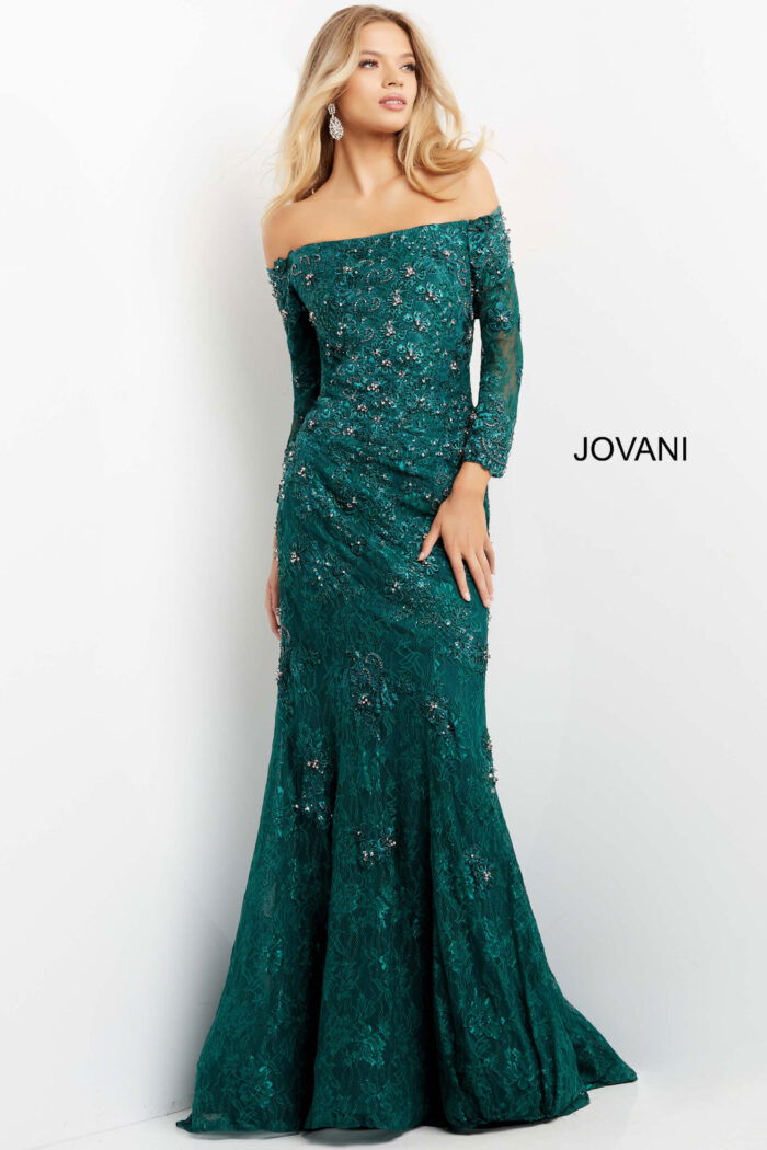 Model wearing Jovani 03651 emerald gown front view featuring off-the-shoulder neckline and sparkling embellishments.