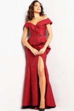 Model wearing Jovani 03944 burgundy gown with peplum waist and high slit