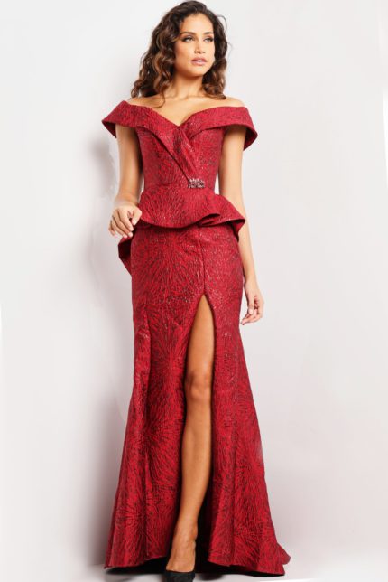 Model wearing Jovani 03944 burgundy gown with off-the-shoulder neckline and peplum waist, front view