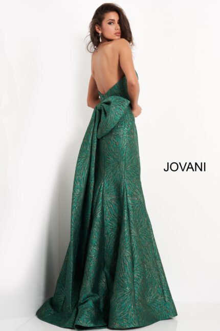 Back view of model wearing Jovani 04158 green gown with large bow accent.