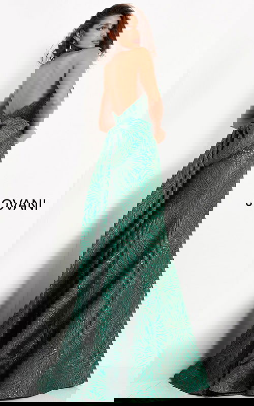 Back view of model wearing Jovani 04158 green gown with large bow accent.