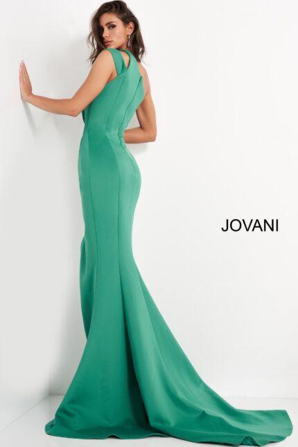 Back view of model wearing Jovani 04222 green gown with flowing hem.