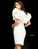 Model wearing Jovani 04367 fitted white dress with ruffled sleeves, back view.