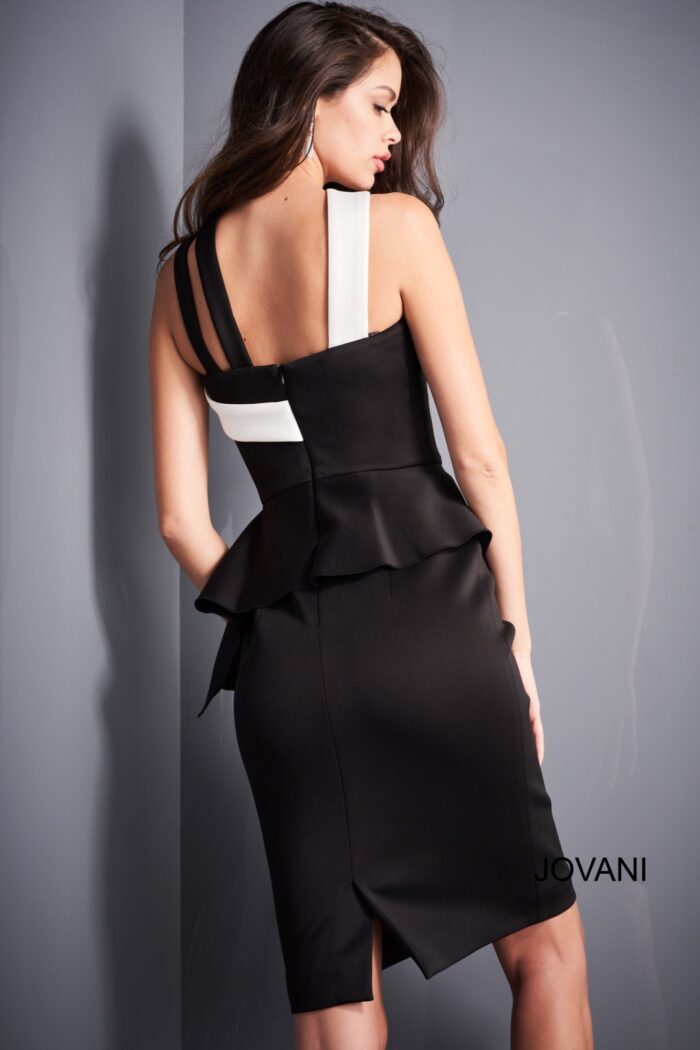 Model showing the back of Jovani 04409 black dress with white trim
