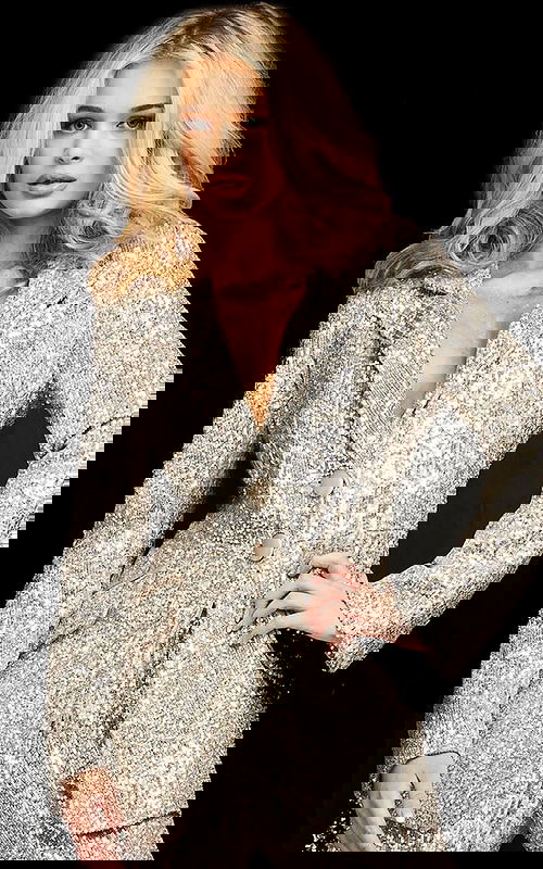 Model wearing Jovani 04904 jacket in nude sequins.