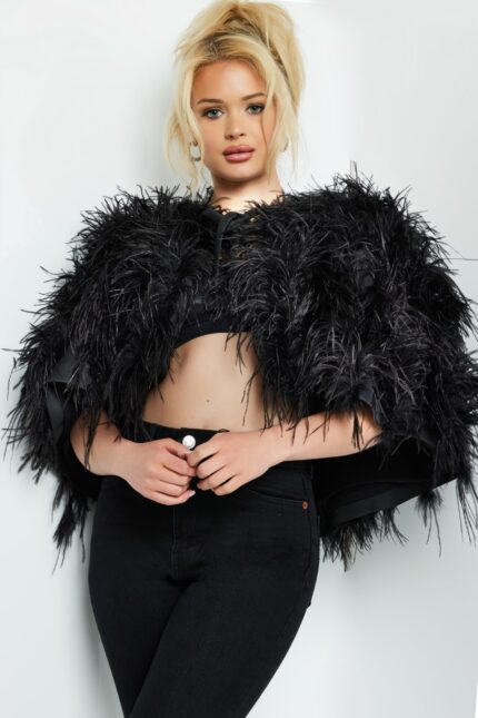 Model wearing Jovani 05257 dress in black with detailed sleeves.