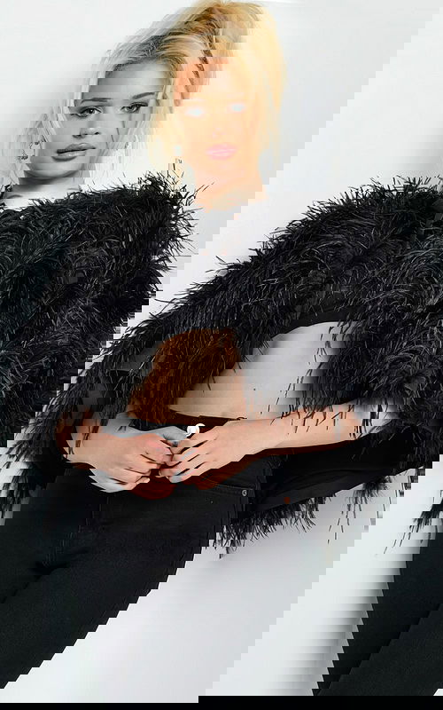 Model wearing Jovani 05257 dress in black with detailed sleeves.