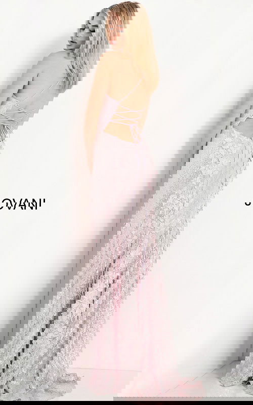 model wearing 06109 ice pink gown showcasing lace-up back design