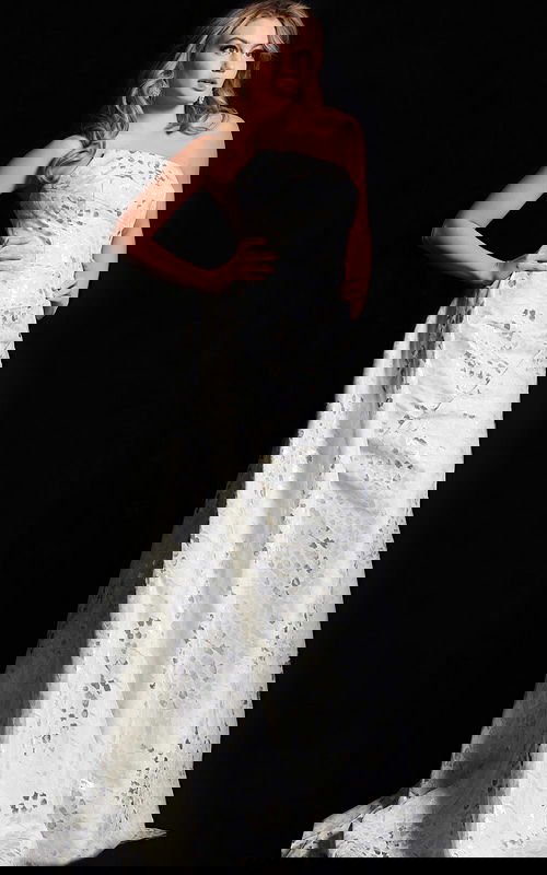 model wearing 06255 elegant beige gown with strapless neckline and textured fabric