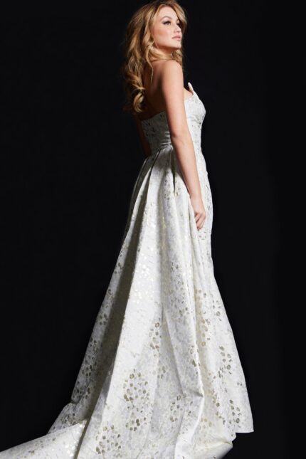 back view of model in 06255 beige gown with textured pattern