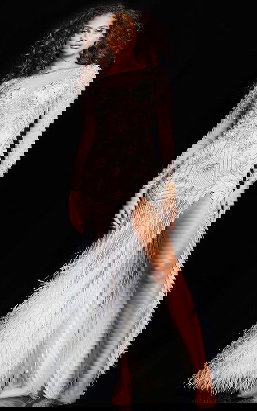 Model wearing Jovani 06344 in white with multi-colored beading and high slit.