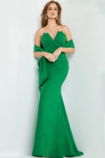 Model wearing Jovani 06403 emerald green gown in a floor-length silhouette.