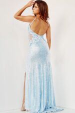 Model wearing Jovani 06426 light blue gown showcasing the back view with floral details.