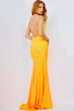 Model wearing Jovani 06450 yellow gown back view