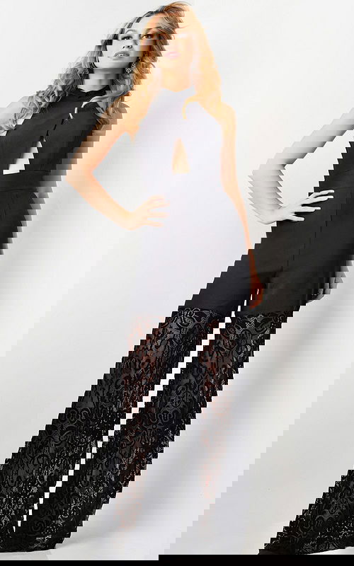 Model wearing Jovani 06612 black dress, front view with lace details and high neckline.