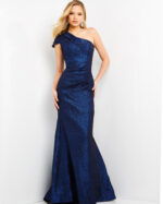 Model wearing Jovani 06751, a floor-length blue gown with one-shoulder neckline.