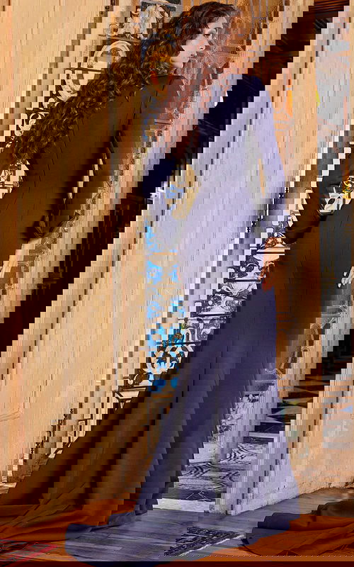 Model wearing Jovani 06774 navy dress, back view