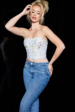Model wearing Jovani 06842, front view with hand on hip