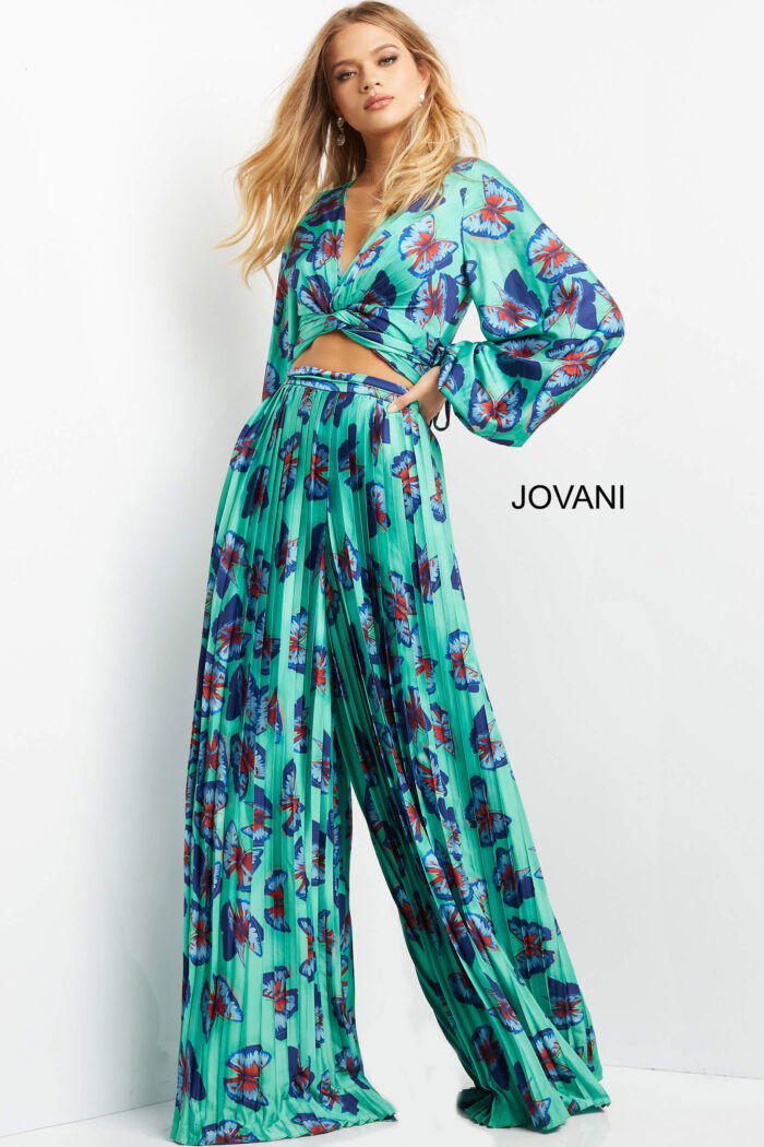 Model in Jovani 06844 showcasing vibrant print and flowing design.