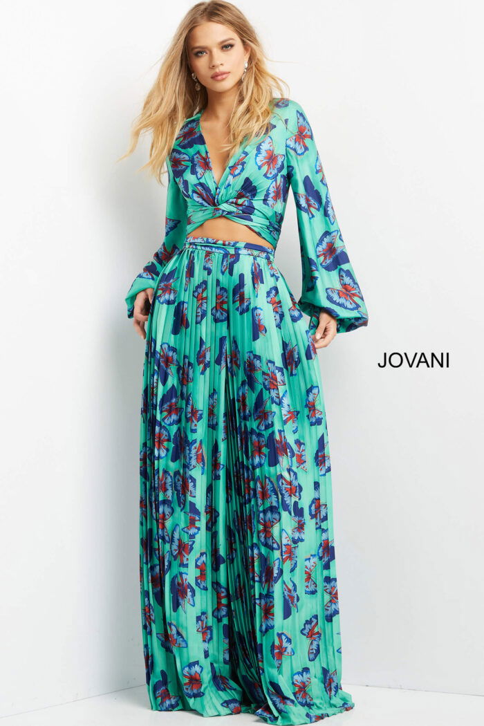 Model in Jovani 06844 front view with V-neckline and pleated skirt.