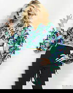 model wearing Jovani 06844 Print top with butterfly print and long sleeves