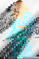 model wearing Jovani 06844 Print top with butterfly print and long sleeves