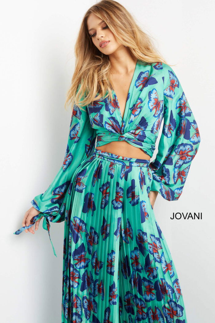 Jovani 06844 with billowing long sleeves and wrap tie back.