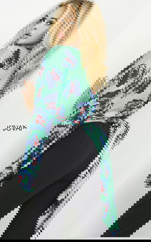 Model in Jovani 06844 showcasing ensemble with billowing sleeves.