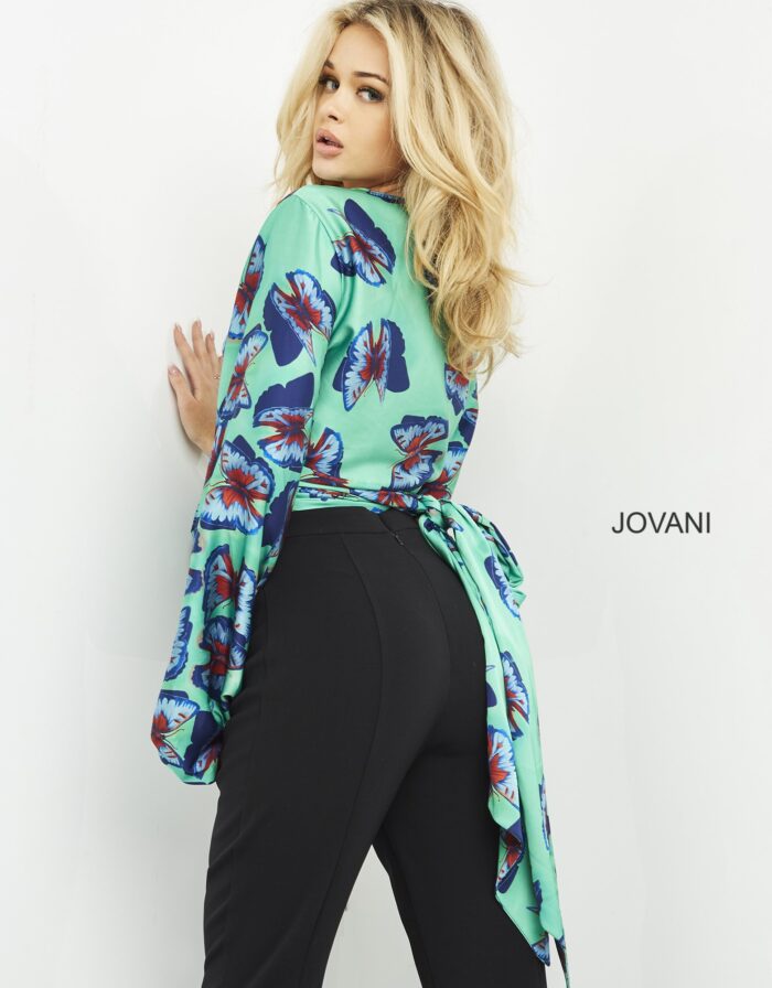 Model in Jovani 06844 showcasing ensemble with billowing sleeves.