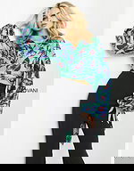 model wearing Jovani 06844 Print top with butterfly print and long sleeves