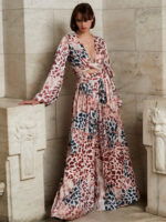 Model in Jovani 06846 dress featuring long sleeves and deep V-neck.