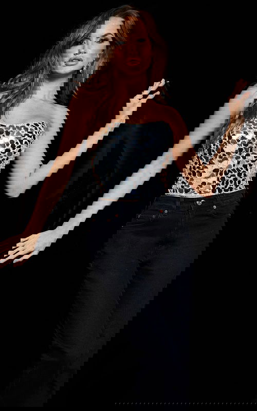 Model wearing Jovani 06855 white dress with mosaic design from front view.