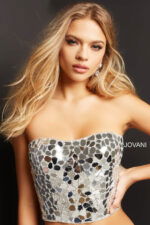 Close-up of model wearing Jovani 06855 white dress with mosaic design.