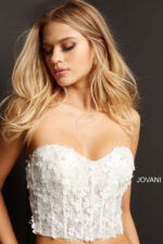 Close-up front look of model wearing Jovani 06856, showing off the strapless design.